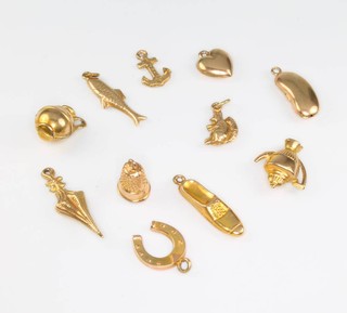 Eleven 9ct yellow gold charms 6.5 grams