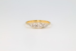 An 18ct yellow gold illusion set 4 stone diamond ring, size P 1/2