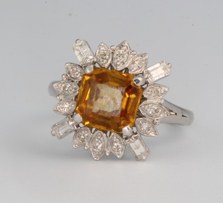 A white gold citrine and diamond cluster ring the centre square stone 8mm x 8mm surrounded by 4 baguette and 12 brilliant cut diamonds size G 