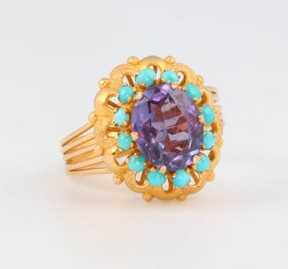 An 18ct yellow gold amethyst and turquoise dress ring size Q 