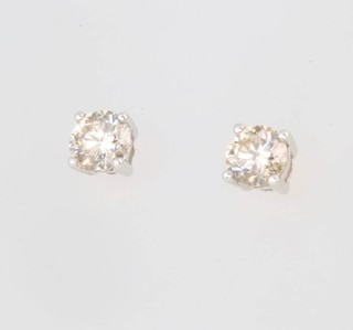A pair of 18ct white gold single stone brilliant cut diamond ear studs, approx. 0.6ct