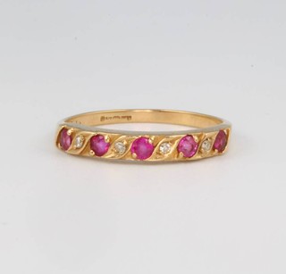 A 9ct yellow gold ruby and diamond ring size K 