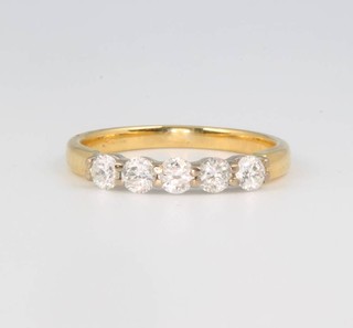 A yellow gold five stone diamond ring size K 