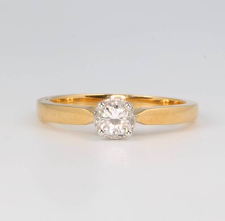 An 18ct yellow gold single stone diamond ring 0.54ct, size N 1/2