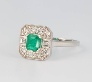 An 18ct white gold Art Deco style emerald and diamond cluster ring size N 