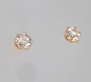 A pair of 18ct yellow gold single stone diamond ear studs, approx 0.2ct 