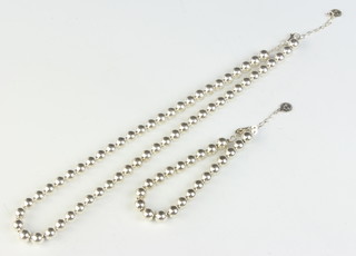 A silver bead necklace and bracelet 63 grams 