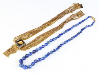 A lapis lazuli bead necklace and a gilt necklace 