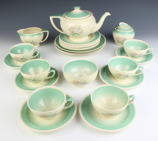A Susie Cooper Art Deco part tea set comprising teapot, milk jug, sugar basin, sugar bowl and lid, slop basin, 6 cups, 6 saucers, 6 small plates, 3 sandwich plates