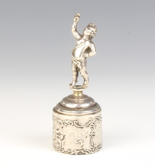 A Continental silver bottle stopper in the form of a figure holding aloft a cup 