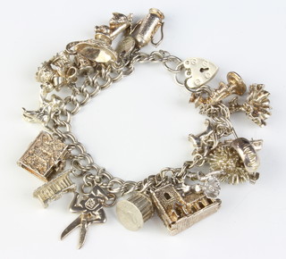 A silver charm bracelet 77 grams