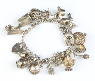 A silver charm bracelet 69 grams