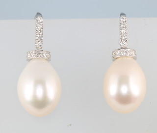 A pair of 18ct white gold cultured fresh water pearl and diamond drop earrings, approx. 0.4ct
