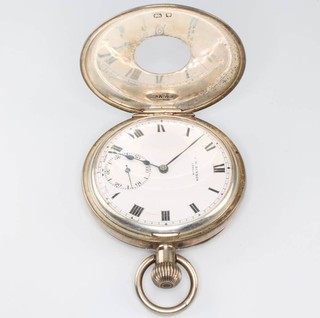 A silver half hunter mechanical pocket watch the dial inscribed J W Benson London with seconds at 6 o'clock 