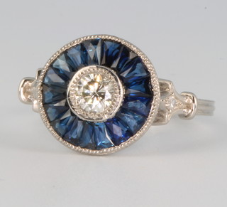 A platinum Art Deco style sapphire and diamond target ring size N 