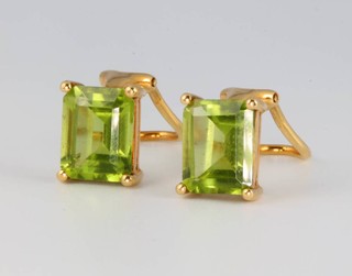 A pair of 18ct yellow gold Victorian style emerald cut peridot ear clips 