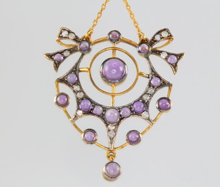 An Edwardian style yellow gold amethyst and diamond open pendant on a 9ct yellow gold chain 