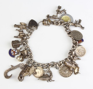 A silver charm bracelet 98 grams