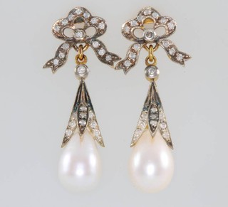 A pair of Edwardian style yellow gold cultured pearl and diamond drop earrings