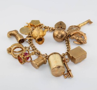 A 9ct yellow gold charm bracelet and charms, gross 38 grams