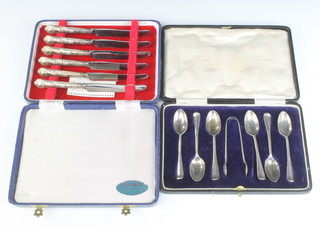 A cased set of 6 silver rat tail teaspoons and nips London 1922 and a cased set of silver handled butter knives 