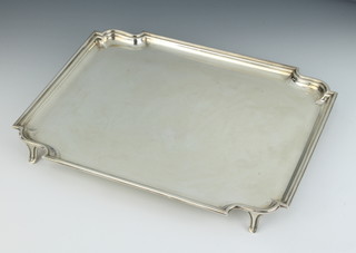 A rectangular silver salver with pie crust rim on swept, Sheffield 1931, maker Frank Cobb & Co Ltd, 30cm x 25cm, 804 grams