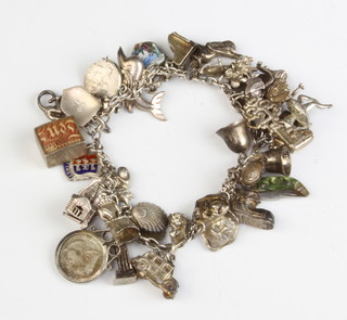 A silver charm bracelet 76 grams