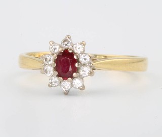 An 18ct yellow gold ruby and diamond cluster ring size L 