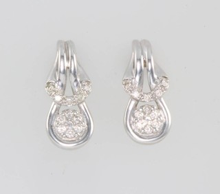 A pair of 9ct white gold diamond earrings