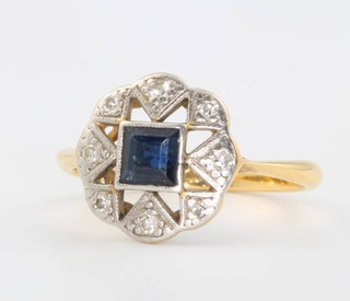 An 18ct yellow gold sapphire and diamond cluster ring size N 
