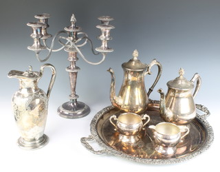 A silver plated 5 light candelabrum, a 3 piece tea set, hot water jug and tray 