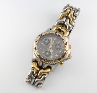 A gentleman's bimetallic Tag Heuer professional wristwatch with calendar and 3 subsidiary dials on a bimetallic bracelet, boxed