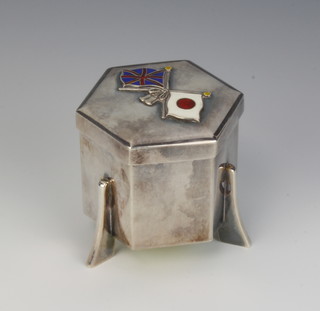 A Japanese silver hexagonal box with enamelled Union flag and Japanese flag raised on fin feet by Miyamoto 6cm 