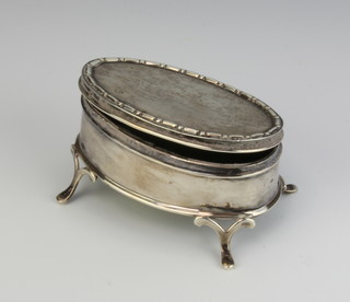 An oval repousse silver trinket box London 1911 7cm