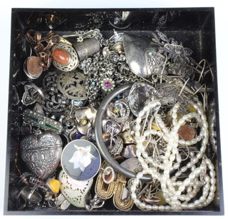 A repousse silver heart shaped locket, a hardstone seal and a quantity of silver jewellery