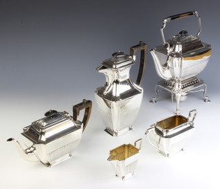 An Edwardian silver plated 5 piece tea and coffee set comprising tea kettle on stand, coffee pot, teapot, sugar bowl and cream jug with demi-fluted decoration and chased monogram 
