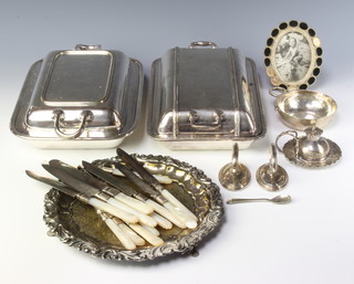 A silver plated entree pair and minor plated items