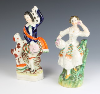 A Victorian Staffordshire figure of a Scottish lady 20cm, a ditto of a highland gentleman holding aloft a rabbit 23cm 