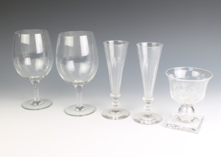 A 1935 George V Jubilee T Goode & Co glass vase with coin stem and 4 other glasses