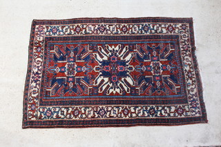 A blue and tan ground Persian Heriz rug 208cm x 140cm 
