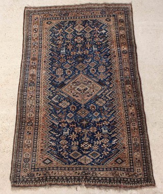 A blue and white ground Persian Qashqai rug with central medallion 202cm x 126cm