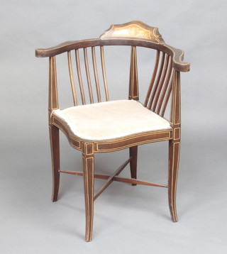 An Edwardian inlaid mahogany corner chair with X framed stretcher and upholstered seat raised on outswept supports