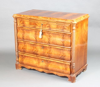 A 19th Century French flame mahogany commode fitted 4 drawers with turned columns to the sides 86cm h x 99cm x 53cm 