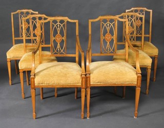 A set of 6 Edwardian pierced and inlaid mahogany slat back dining chairs comprising 2 carvers and 4 standard, raised on square tapered supports