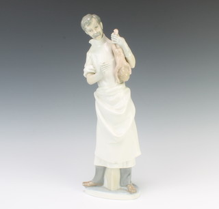 A Lladro figure of a obstetrician by the sculptor Salvatore Furio 36cm 