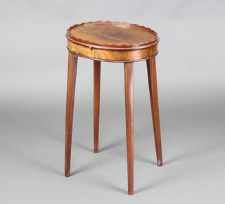 A Georgian style oval bleached mahogany urn table with wavy border, fitted a cup slide and raised on square tapered supports 61cm h x 39cm w x 31cm d 