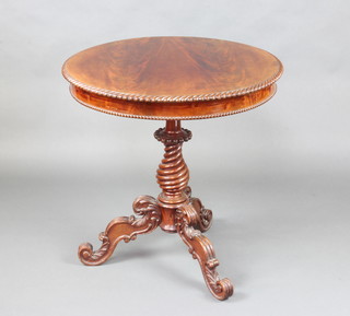 A circular Victorian Irish mahogany occasional table with gadrooned border raised on a bulbous spiral turned column and carved tripod supports 75cm h x 74cm diam. 
