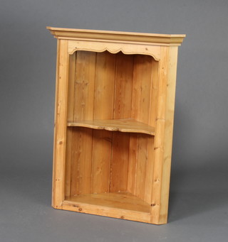 A pine hanging corner cabinet with moulded cornice fitted a shelf 96cm h x 72cm w x 41cm d together with a pine range of shelves