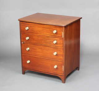 A 19th Century mahogany commode in the form of a 4 drawer chest, the panelled door with brass handles, raised on bracket feet 70cm x 65cm x 48cm 
