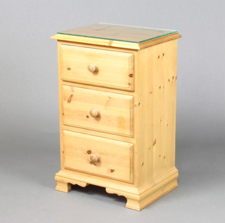 A pine pedestal bedside chest of 3 long drawers, raised on ogee bracket feet 67cm h x 43cm w x 32cm d 